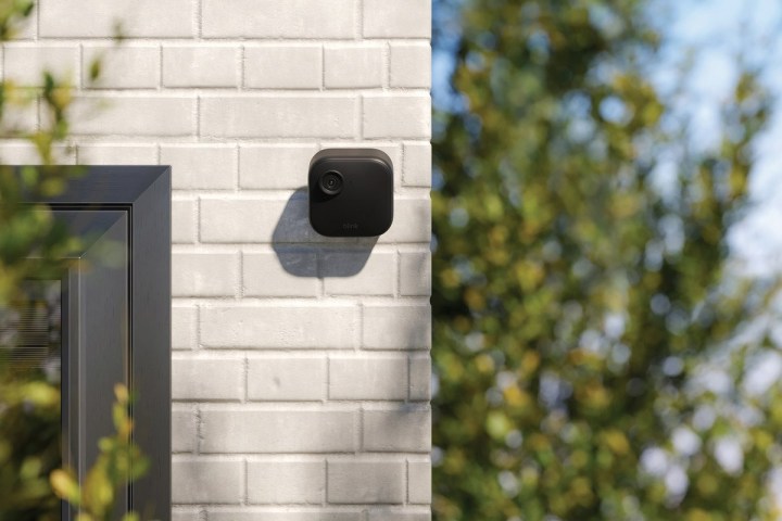 The Blink Outdoor Camera 4 mounted on a brick wall.
